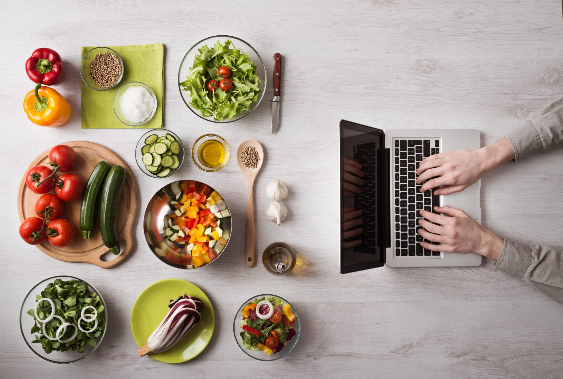 large - table veggies man hand laptop